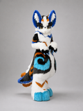 HERALD — a one-of-one kemono fullsuit by Fulu Fursuits in white, royal blue, cyan and orange, with tall ears and a long patterned tail