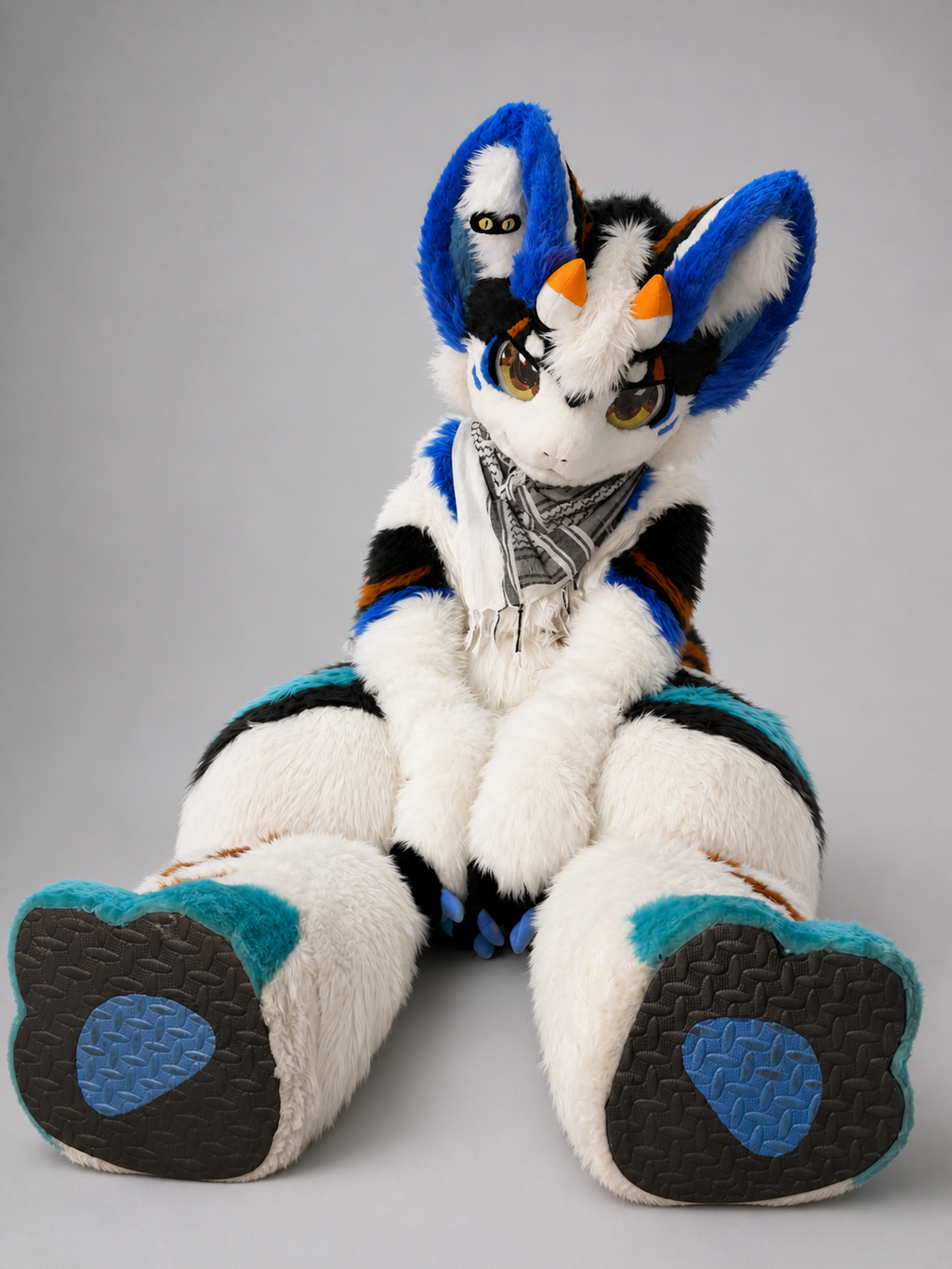 HERALD — a one-of-one kemono fullsuit by Fulu Fursuits in white, royal blue, cyan and orange, with tall ears and a long patterned tail