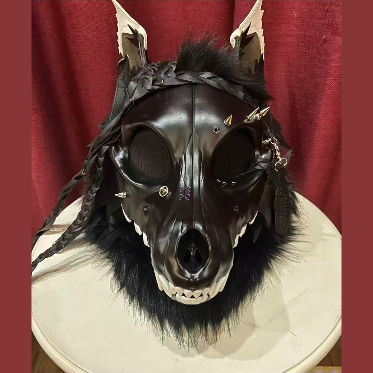 CURFEW — a one-of-one skulldog fursuit head by Fulu Fursuits: a black resin wolf skull with white teeth and an articulated jaw, leather ears and braided leather falls