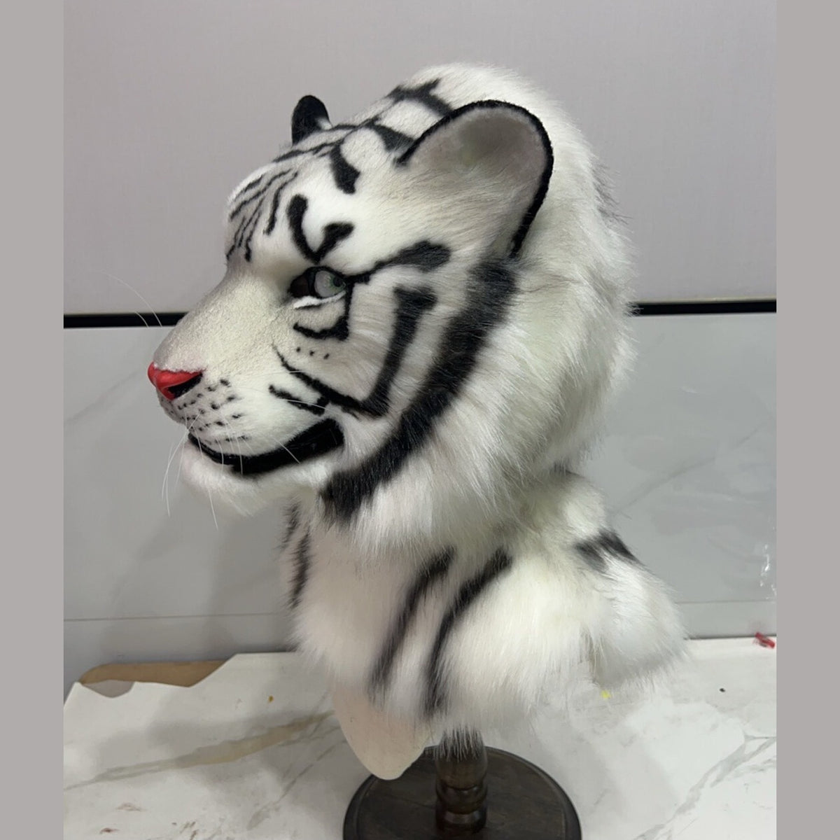 FROST — a one-of-one realistic white tiger fursuit head by Fulu Fursuits, white faux fur with black stripes, pale green eyes and a coral nose
