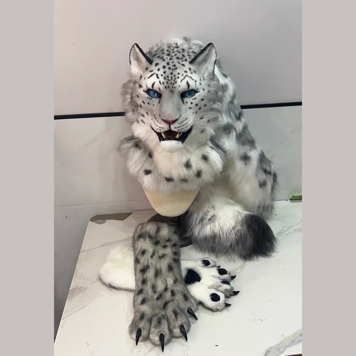 GHOST — a one-of-one realistic snow leopard partial by Fulu Fursuits: head, handpaws and tail in gray and white with black rosettes and blue eyes