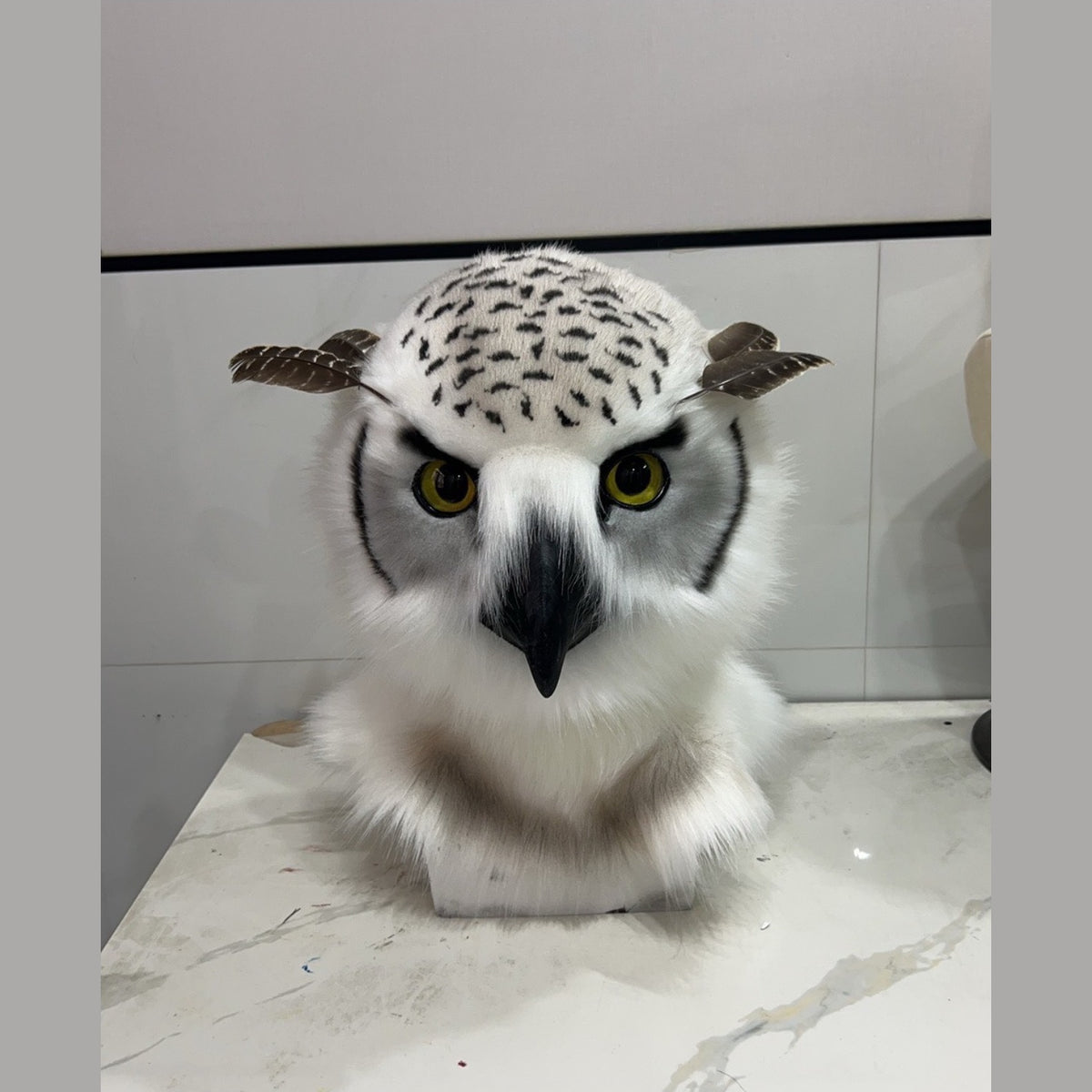 HUSH — a one-of-one realistic owl fursuit head by Fulu Fursuits, white with black flecking, yellow eyes and a black beak