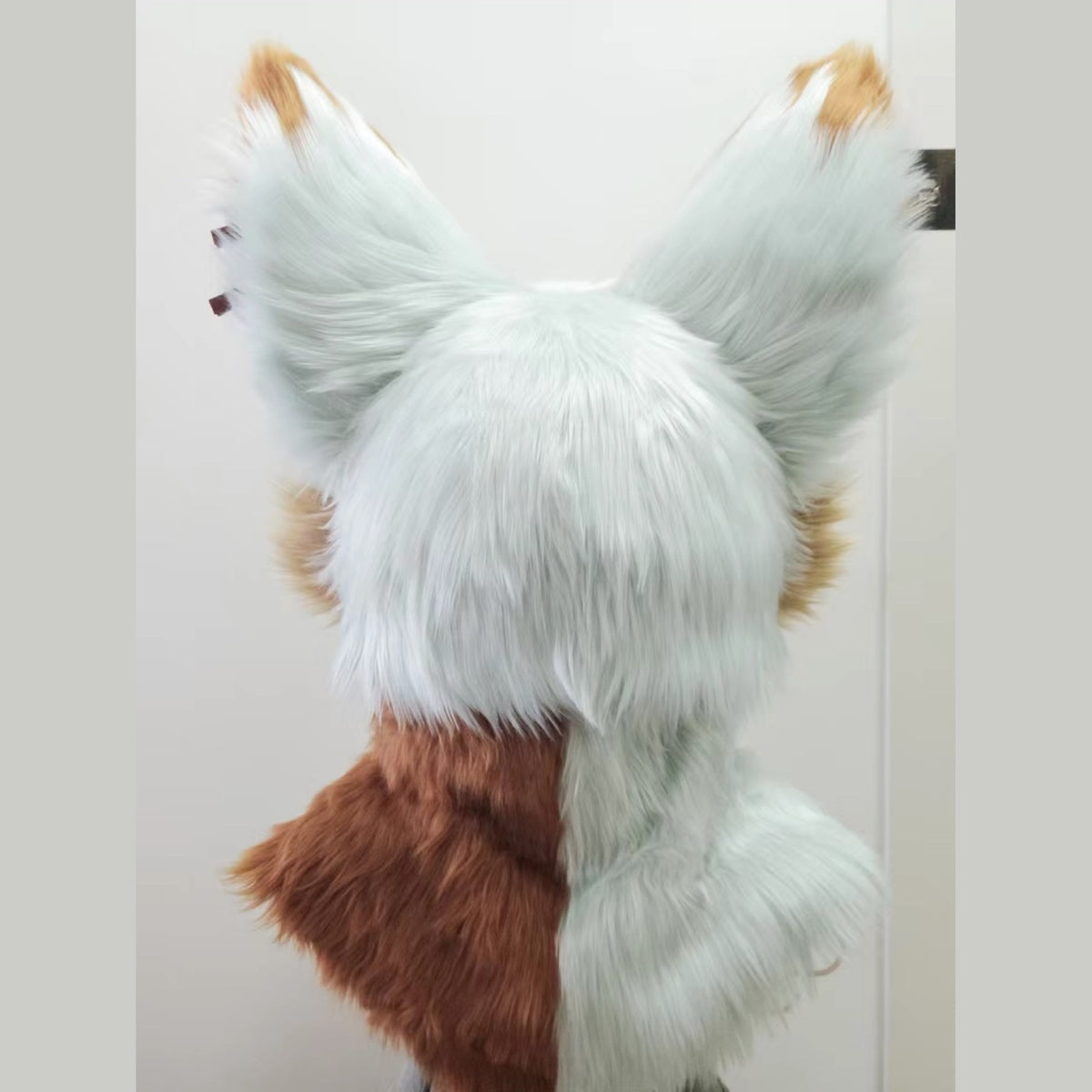 LATTE — a one-of-one toony fursuit head by Fulu Fursuits in mint white and caramel, with tall pink-lined ears and large stylised eyes